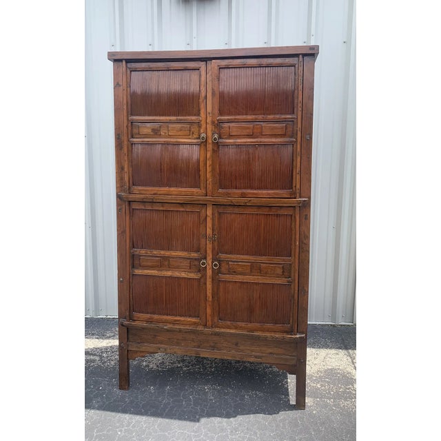 Lovely Asian style look. This light-weight Qing Dynasty cabinet is made of elm and bamboo split vertically. The doors are...