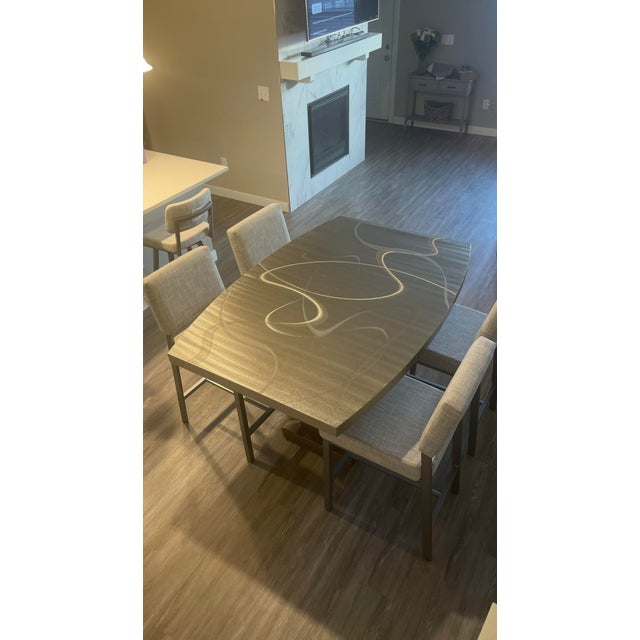 Beautiful, high-quality silver counter-height dining set by Metall Furniture. Clean modern/industrial boat shape design...
