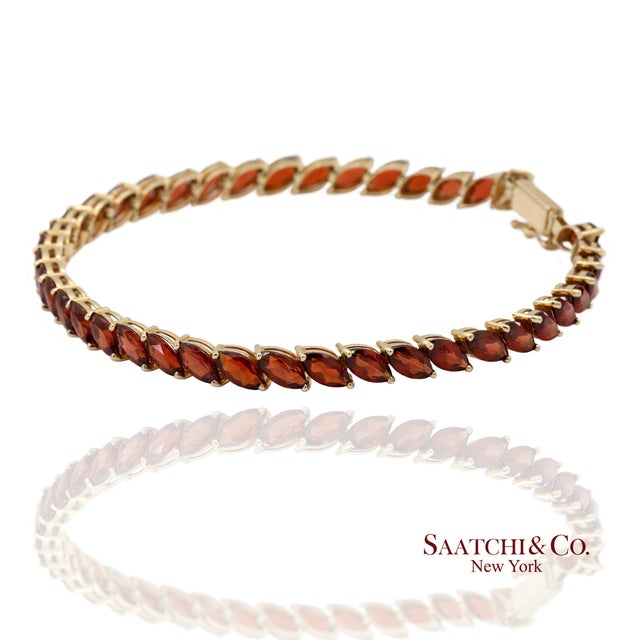 14K Solid Yellow Gold Garnet Tennis Bracelet Metal Type: 14k Solid Yellow Gold Total Item Weight: 7.8 Grams Length: 7.5 in...