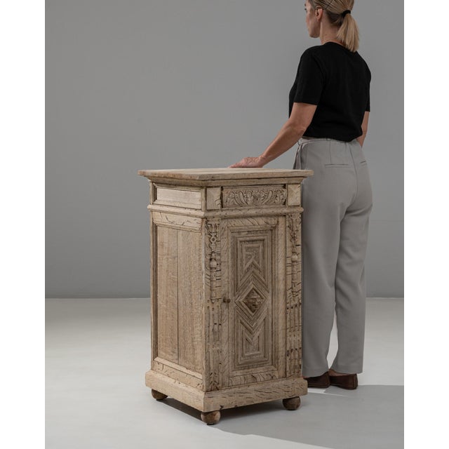 This 1890s French Renaissance Revival oak bedside table showcases exceptional craftsmanship and richly detailed carving...
