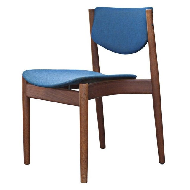A set of four mid century modern dining chairs designed by Finn Juhl and made by France and Son. Model 197 with teak...