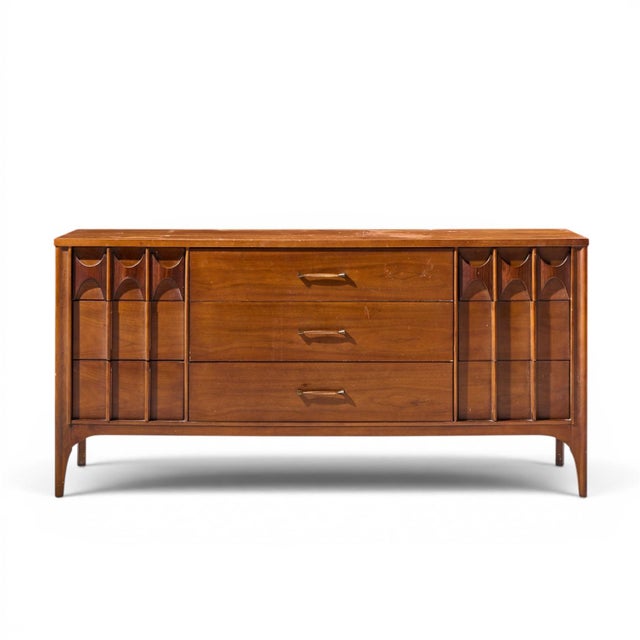 Kent Coffey Perspecta Mid Century Walnut and Rosewood 9-Drawer Dresser This lowboy measures: 64 wide x 19 deep x 31.25...