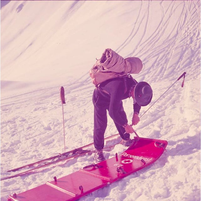 Mountain Top 1951 A member of the Klosters ski patrol checks a stretcher, Switzerland, 1951. Toni Frissell Antoinette...