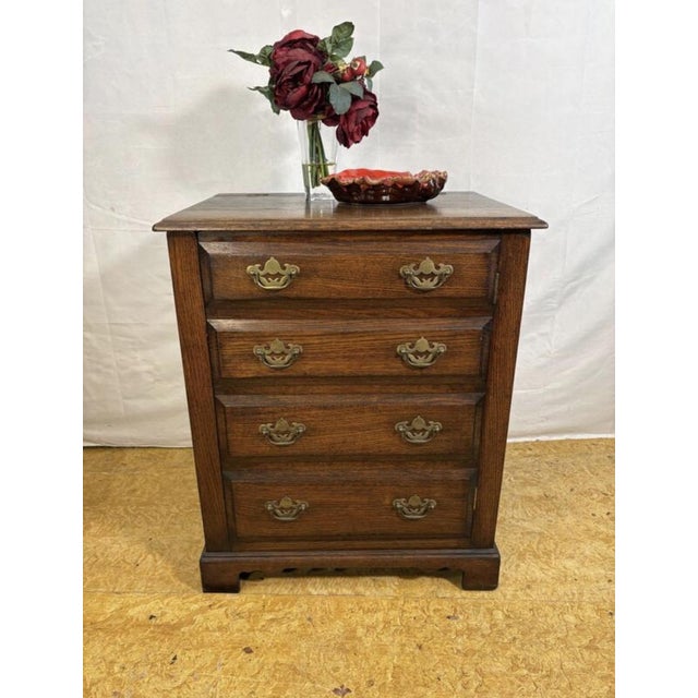 A charming and unusual vintage record cabinet designed to resemble a traditional chest of drawers. This characterful piece...