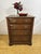 A charming and unusual vintage record cabinet designed to resemble a traditional chest of drawers. This characterful piece...