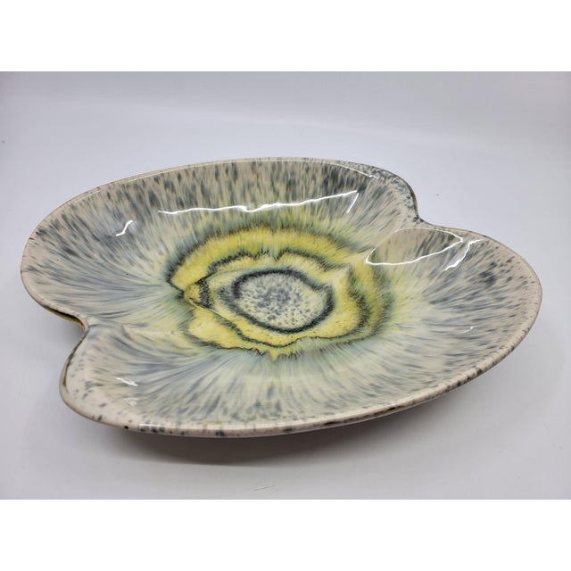 This piece is a large ceramic bowl or trinket dish, a characteristic example of West German production from the 1970s. Its...