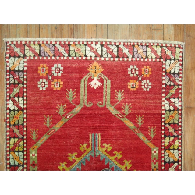 An early 20th century Turkish Melas rug in vivacious colors 3' x 4'7'' Antique Melas rugs feature a unique composition...
