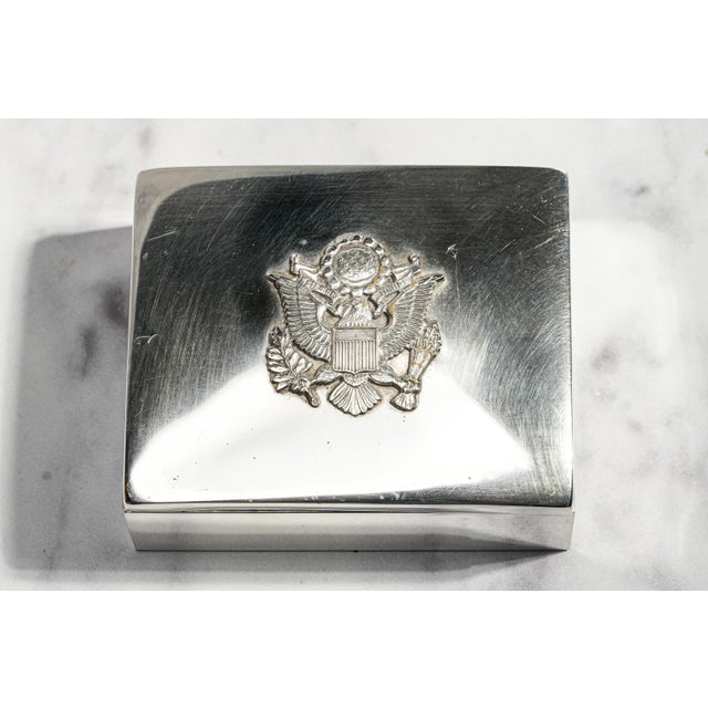 This circa 1940s sterling silver box combines understated mid-century design with an impressive centerpiece. The clean,...