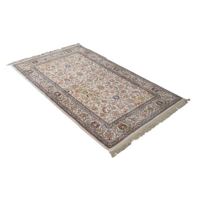 Vintage Karastan 100% wool area rug / mat / carpet featuring a floral motif inspired by palmettes and scrolled vines with...