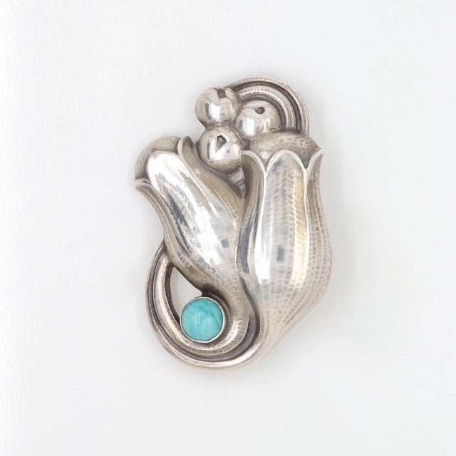 A fine Georg Jensen sterling silver pin or brooch. Model no. 100B. Designed by Georg Jensen. In the form of hand-hammered,...