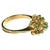 Vintage 14K Gold Emerald and Diamond Floral Cluster Cocktail Ring, circa 1960s-1970s. Ring features seven small round...
