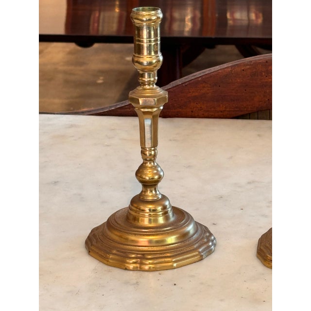 A pretty pair of brass candlesticks. Nice patina.