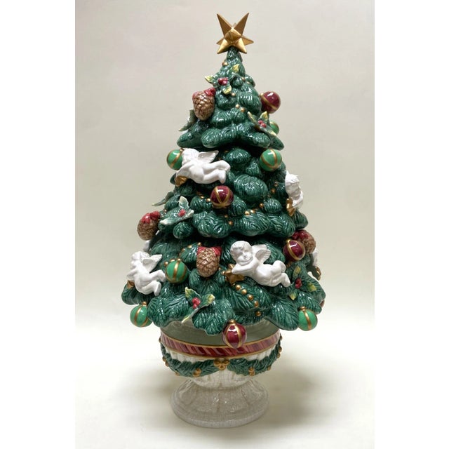 This 19-inch Fitz and Floyd Aegean Christmas Tree Centerpiece is a festive and elegant holiday display, adorned with...