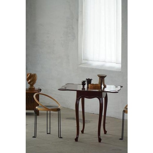 An elegant 19th century Neo-Rococo game table / desk crafted in mahogany, reflecting the decorative revival styles of the...