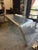Striking aviator-style desk by Restoration Hardware, crafted in aluminum with a sculptural, aerodynamic silhouette. This...
