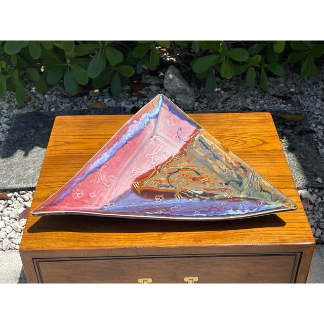 Impressive oversized signed studio art pottery centerpiece featuring a dramatic triangular form and richly layered...