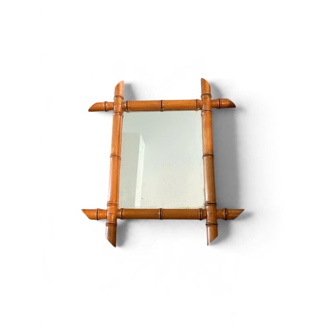 An antique French mirror in carved wood, made to look like bamboo, with its original glass and polished patina. Can be...