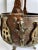 Vintage rustic, primitive folk art copper and brass three footed pot with handle. Old patina intact. Some oxidized copper.