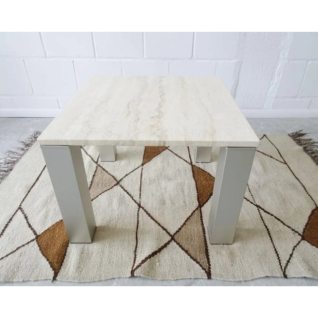 Square coffee table made of travertine and metal. A timeless side table in the style of Vico Magistretti. Light beige...