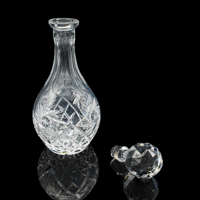 This is a vintage liqueur decanter. An English, cut crystal glass Sherry or wine vessel, dating to the mid 20th century,...