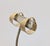 1970s goldtone smooth and textured hoop clip earrings. Marked crown "TRIFARI ©." Measure: 1 inch tall by 5/8 inches wide...