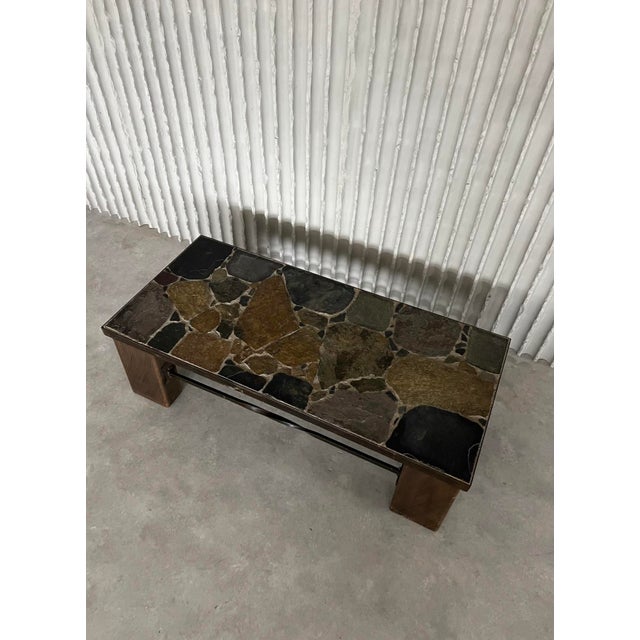 A striking coffee table that combines the raw beauty of natural slate with the warmth of solid wood and the strength of...
