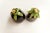 A pair of handcrafted art glass oil lamps in a distinctive eggplant shape, signed on the bottom by artist Lewis Haynes....