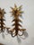 Note: We are able to wire these if requested for a small fee. This matched pair of three-light wall sconces presents a...