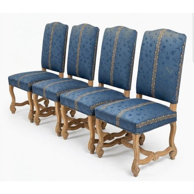 The image features a beautiful set of four dining chairs designed in the French Baroque revival taste, showcasing classic...
