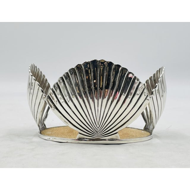 A beautifully sculptural Emilia Castillo silver-plated wine bottle coaster, handcrafted in Taxco, Mexico during the 1980s....