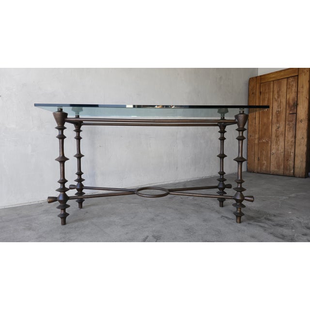 Substantial and gorgeous sculptural console table in the style of Diego Giacometti. Table base is cast aluminum with a...