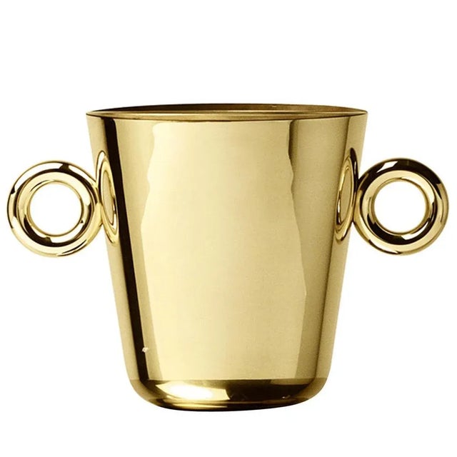 This exquisite steel ice bucket with a brass finish by Richard Hutten has a minimalist shape adorned by the presence of...