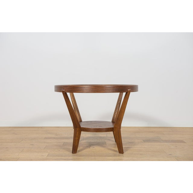 A round coffee table designed by architect duo k. Kozelka & a. Kropacek in 1944. Produced by interier praha in the 40's....