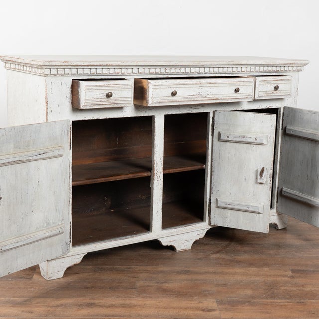 20th-century Swedish sideboard buffet crafted in oak with a three-drawer over three-door configuration. The case is...
