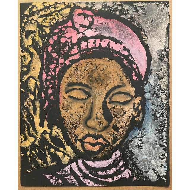 1970s unsigned portrait of a lady in African dress. Thickly printed relief print on black paper. Combined shipping...