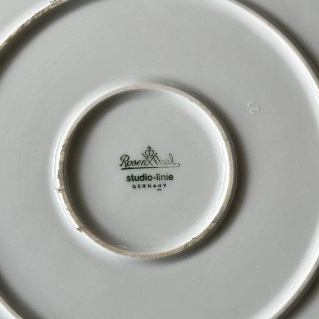 Item: Cake stand, approx. 32 cm Manufacturer: Rosenthal Series: Asimmetria Decoration: White gold Material: Porcelain...