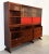 Sideboard consisting of 2 overlapping blocks in Bubba wood, equipped with 2 sliding glass, 4 sliding doors, 2 of which red...