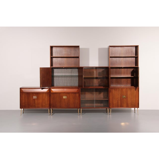 This striking modular wall unit captures the essence of Italian mid-century design from the 1950s–1960s, where...