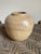Crafted from coarse clay but shows a deft hand. Well made walls and symmetrical shape show the maker’s experience. Tan...