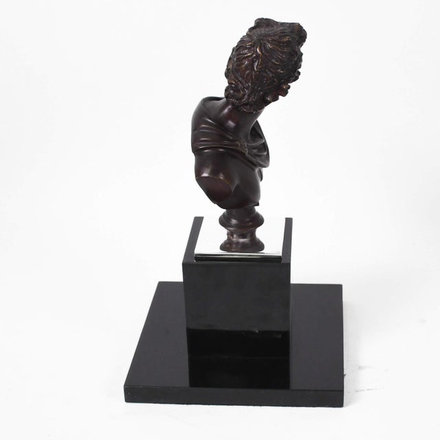 This Unsigned Apollo Belevedere Bronze Sculpture on Black Marble Base captures the god of music, poetry, and prophecy in a...