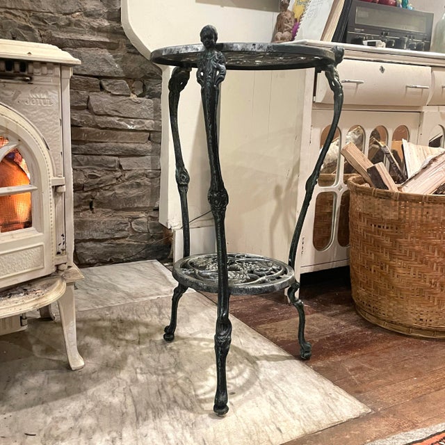 1940s art nouveau metal plant stand or end table. A tiny bit of the original paint job still remains on some of the...