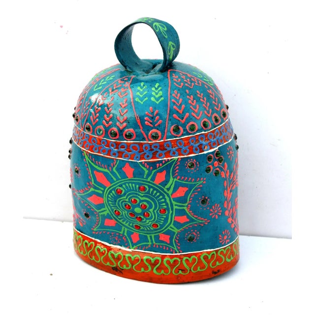 The bell is made of iron and coated primarily with copper, along with a few other metals. They are made from scrap iron...