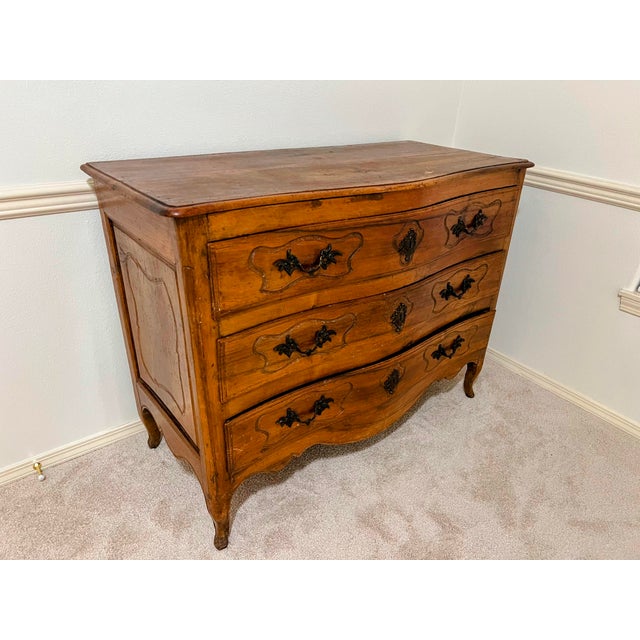 Lovely antique Louis XV style provincial dressor, 19th century. with central floral carving, resting on carved feet. Hand...