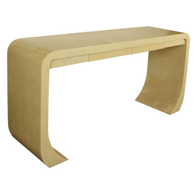 A large and impressive Karl Springer–style waterfall console table, beautifully crafted in faux bone, circa 1980s. The...