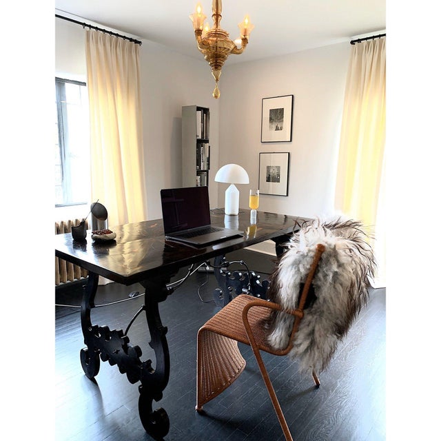 This table or desk features a walnut rectangular top covered in highly polished macassar ebony veneer, with ebonized...