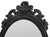 Rococo Style Ebonized Wood Wall Mirror, oval form with shell rocaille motif. 41.5" H x 26" W. Provenance: Property from an...