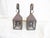 This pair of weathered copper lantern sconces have traces of verdigris appearing and measure 15.25"H x 5"W x 6"D. They...