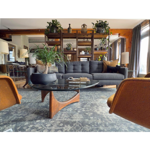 Vintage 1960s Adrian Pearsall triangular coffee table with a thick glass top and sculptural solid walnut base. The angular...