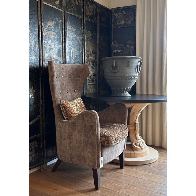 all glamorous wing back chair upholstered exclusively for THE TASTEMAKER SHOPPE. Very comfortable with a sexy curvaceous...