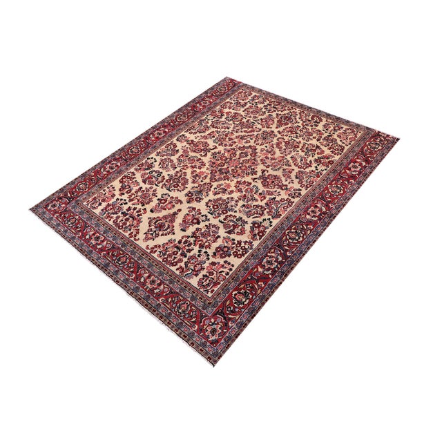 This beautiful, handmade Oriental area rug features an elegant ivory field filled with intricate floral motifs and a...
